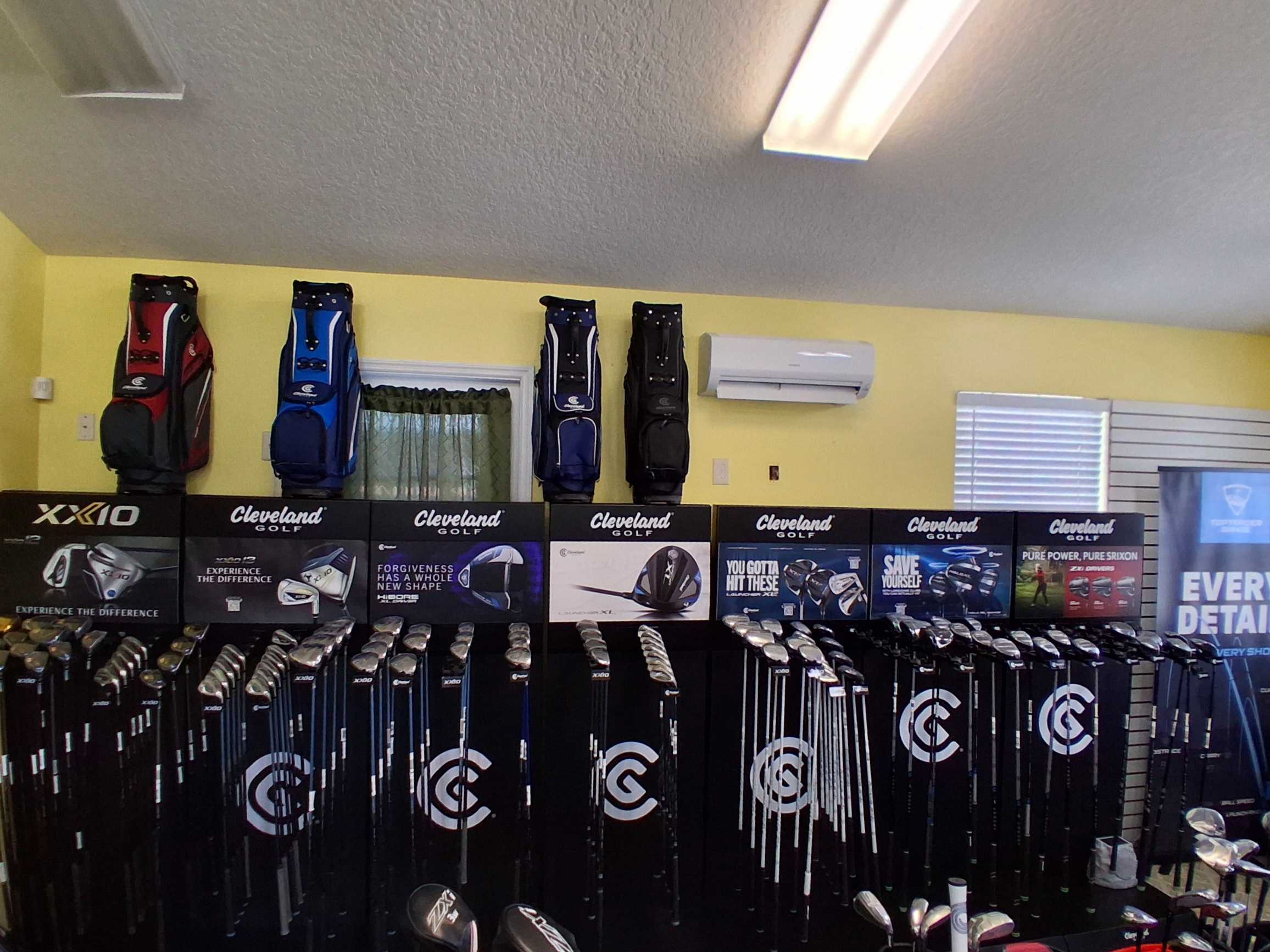 Oxford Golf Academy pro shop interior showing equipment displays and club selection