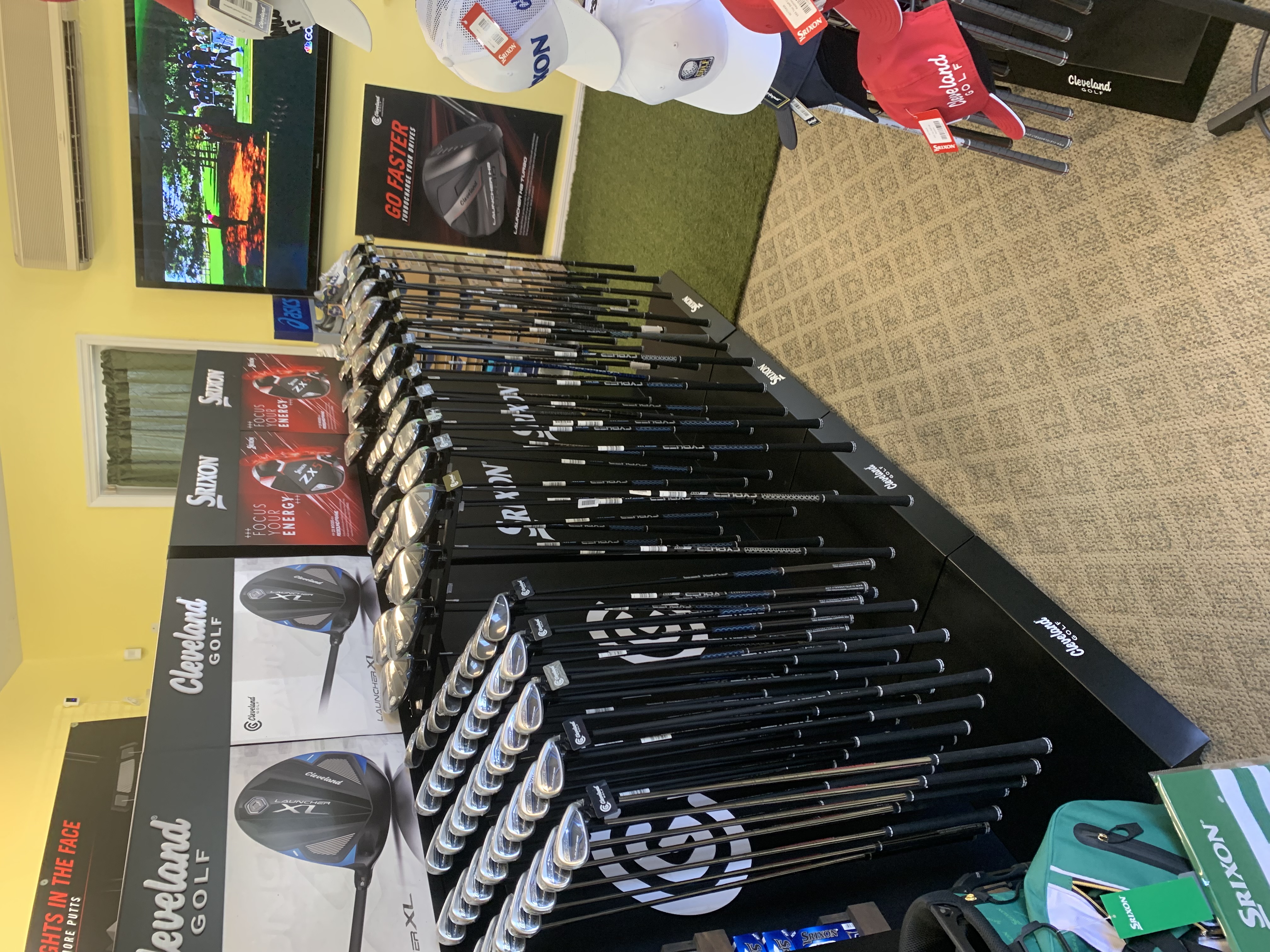 Golf clubs and fitting equipment inside the Oxford Golf Academy pro shop
