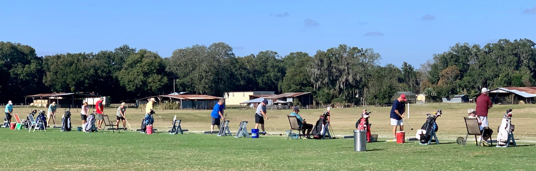 Players practicing across the Oxford Golf Academy range
